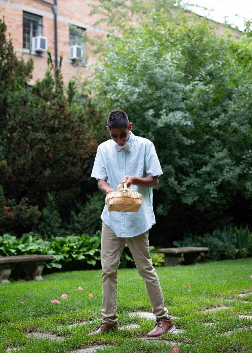 Older kid holding basket down the aisle