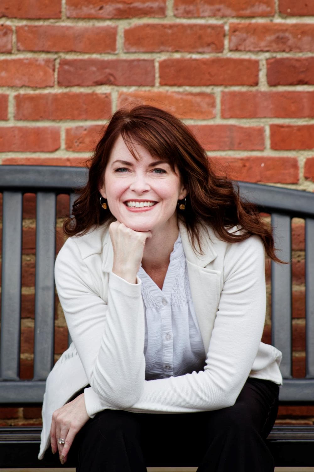 Formal Headshot Portrait Close-up on a Bench with Brick Background