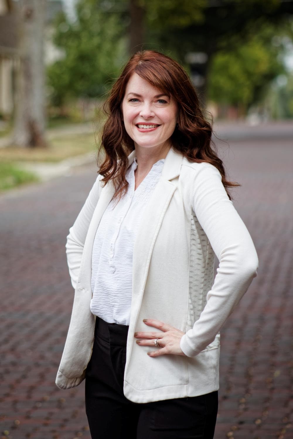 Professional Headshot Standing on a Brick Road